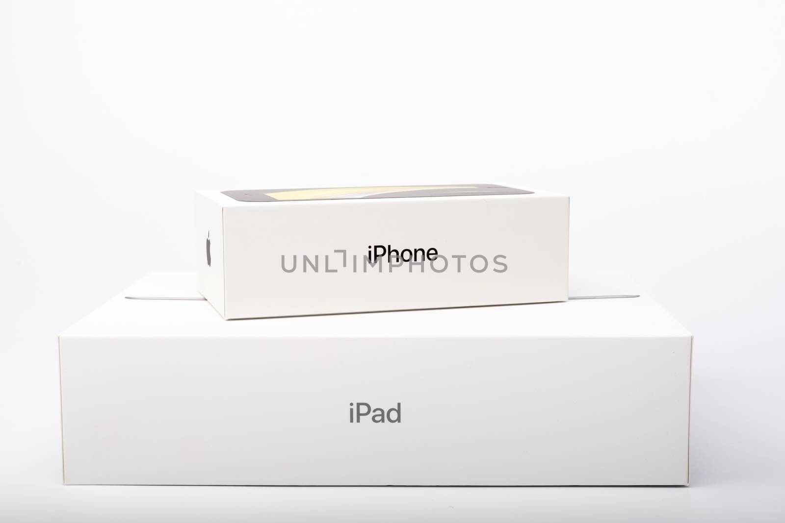 Paris, France - May 14, 2020: packaging of the new black iPhone SE 2020 and iPad from the multinational company Apple during the days of its studio release on a white background