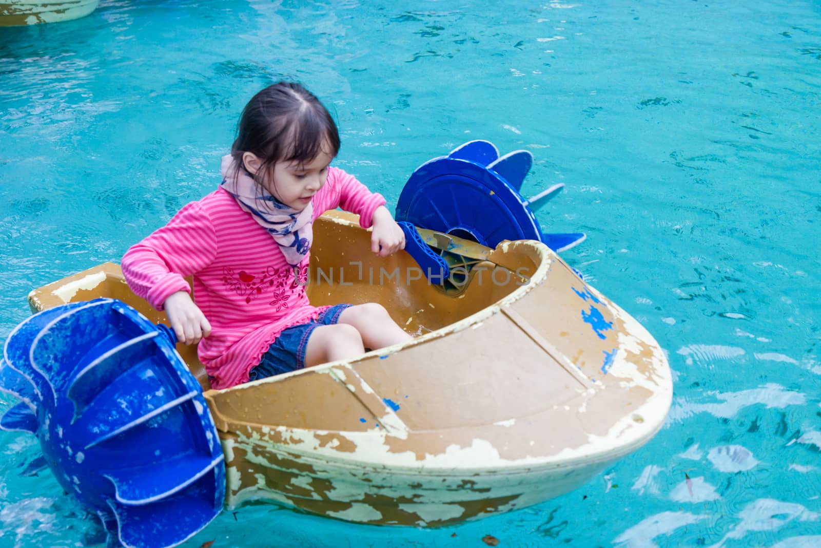 Young girl in paddle boat by imagesbykenny