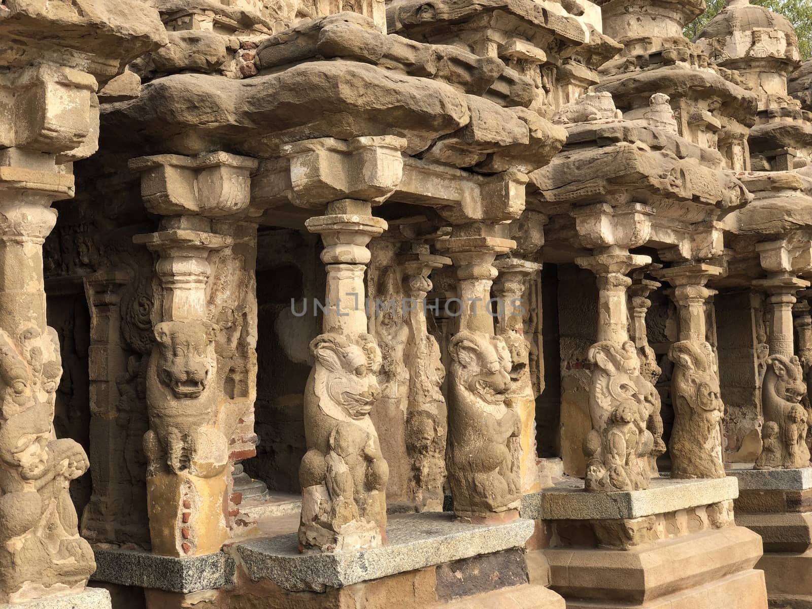 Ancient sandstone sculptures of Lion, Hindu Gods carved in the temple walls at the temple. Old paintings also seen in the walls