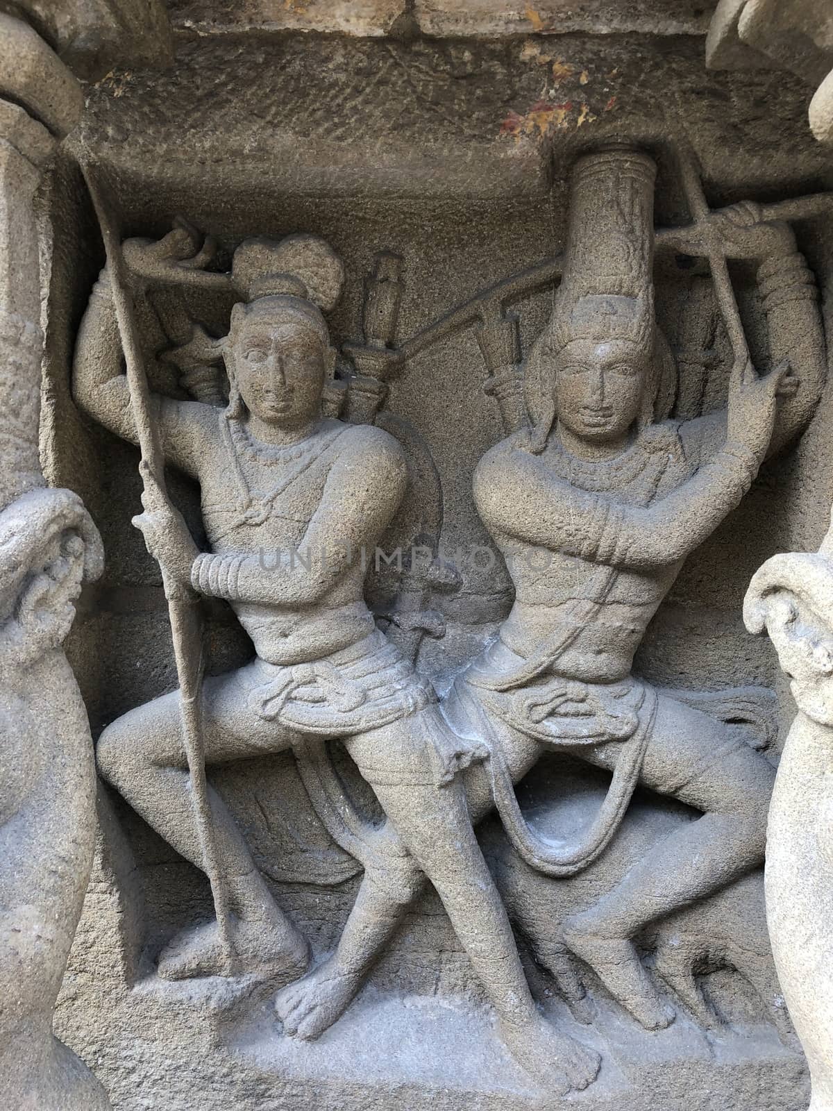 Ancient sandstone sculptures of Lion, Hindu Gods carved in the temple walls at the temple. Old paintings also seen in the walls