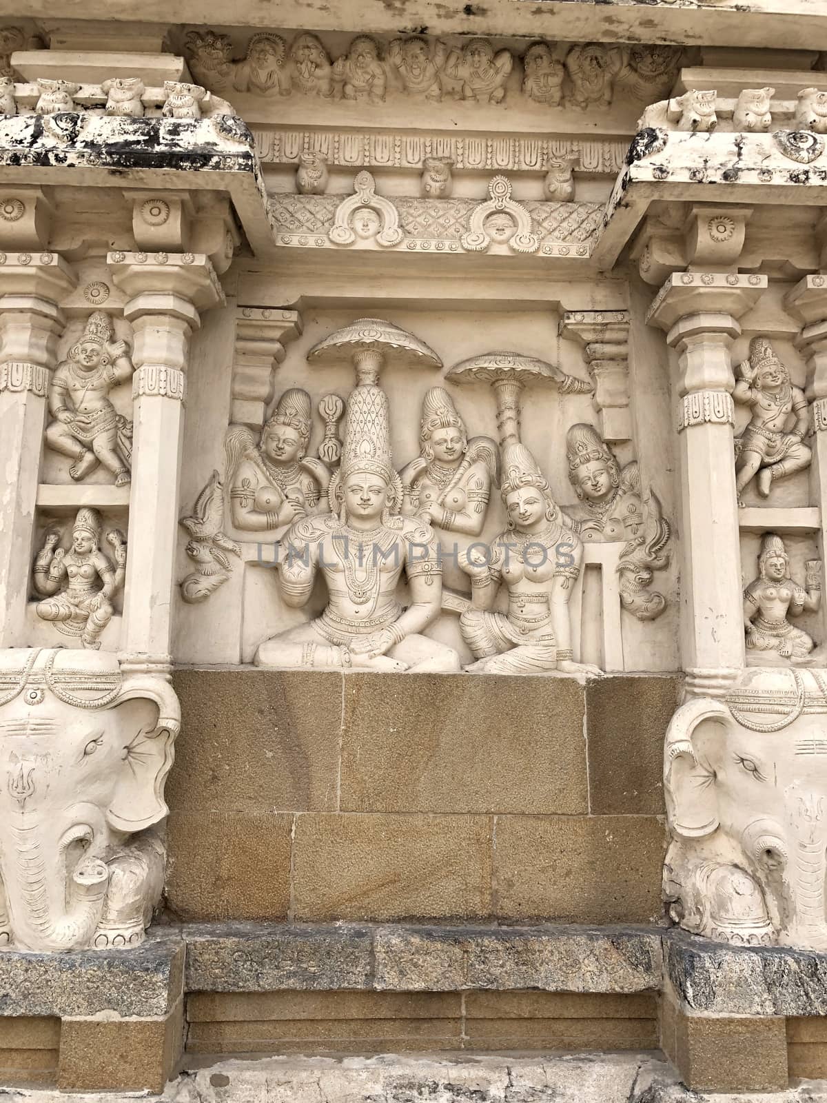 Beautiful historical carving sandstone carving of Hindu Gods Bas relief sculptures carved in the walls of ancient temple in Tamilnadu