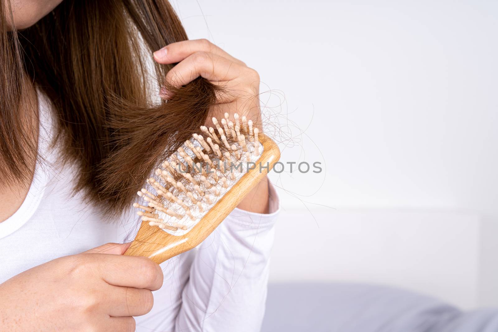 Hair fall problem, closeup hand holding comb and problem hair. Healthcare medical or daily life concept.