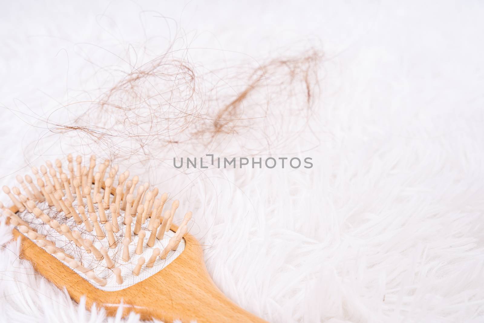 Hair fall problem, closeup comb and problem hair. Healthcare medical or daily life concept.