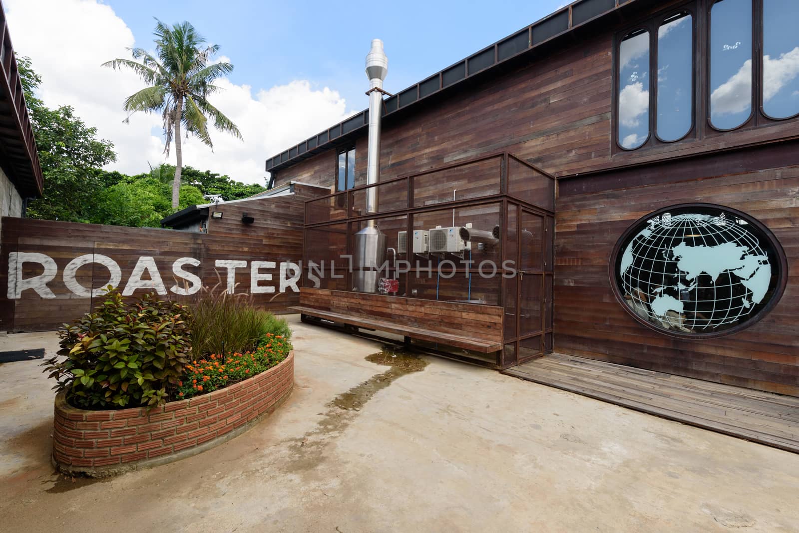 Front side architecture of NANA Hunter Coffee Roasters with a lot customers by rukawajung