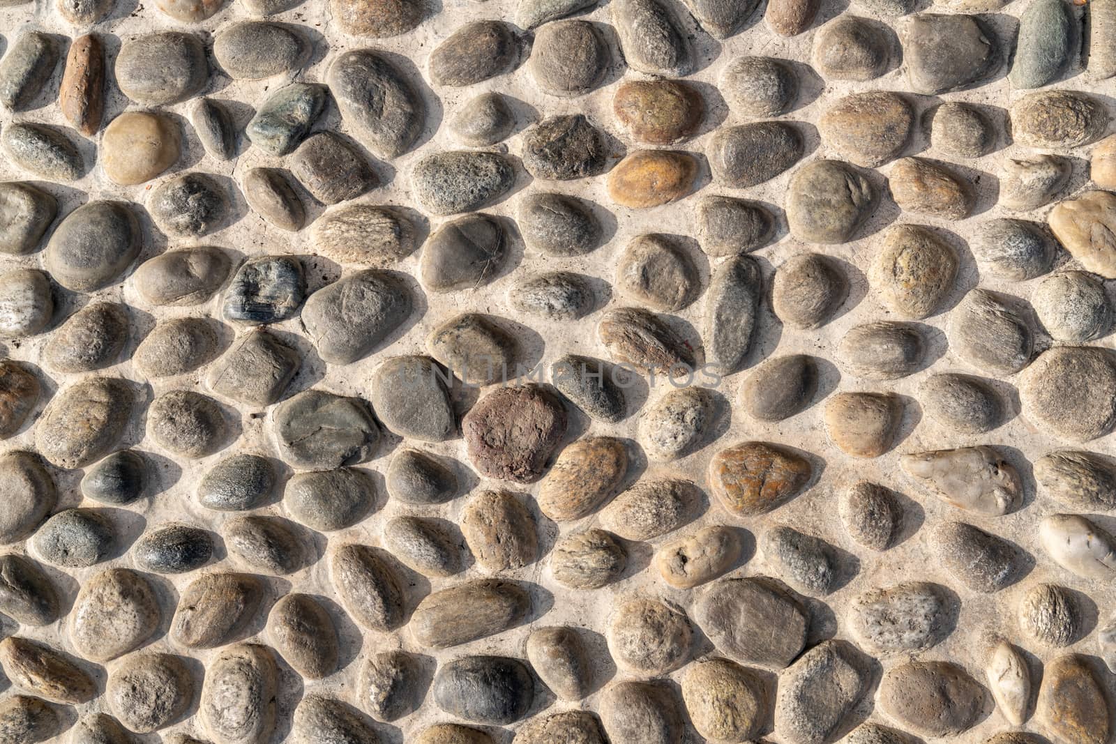 Old natural stone wall, background, texture or pattern. Rustic texture. Wall with bricks of italian stones.