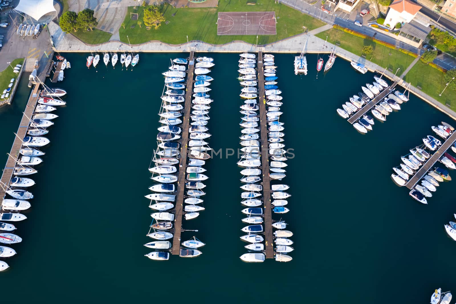 Amazing view of boats moored at dock in Lovere port by Robertobinetti70