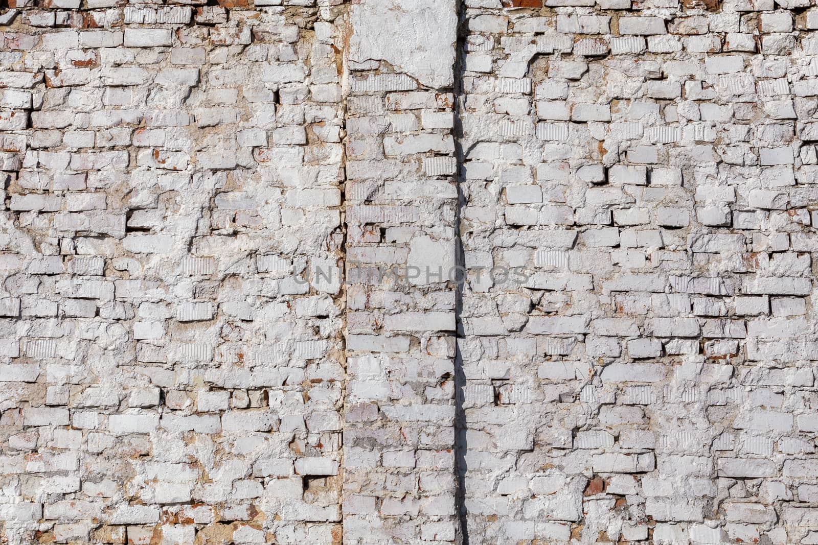 old brick wall with white plaster - full frame background and texture.