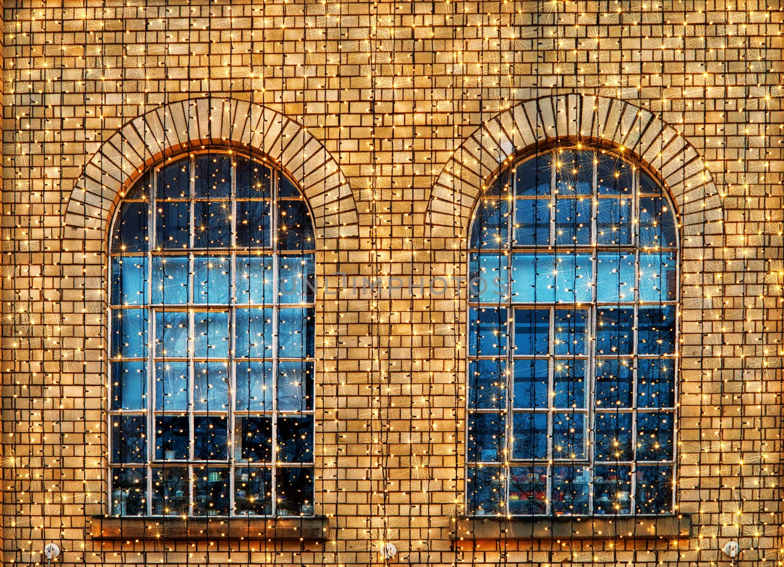 Detail of a building with brick wall and windows
