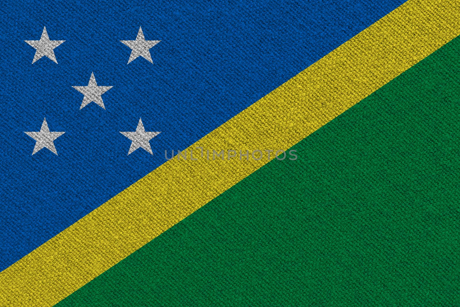 Solomon Islands fabric flag. Patriotic background. National flag of Solomon Islands
