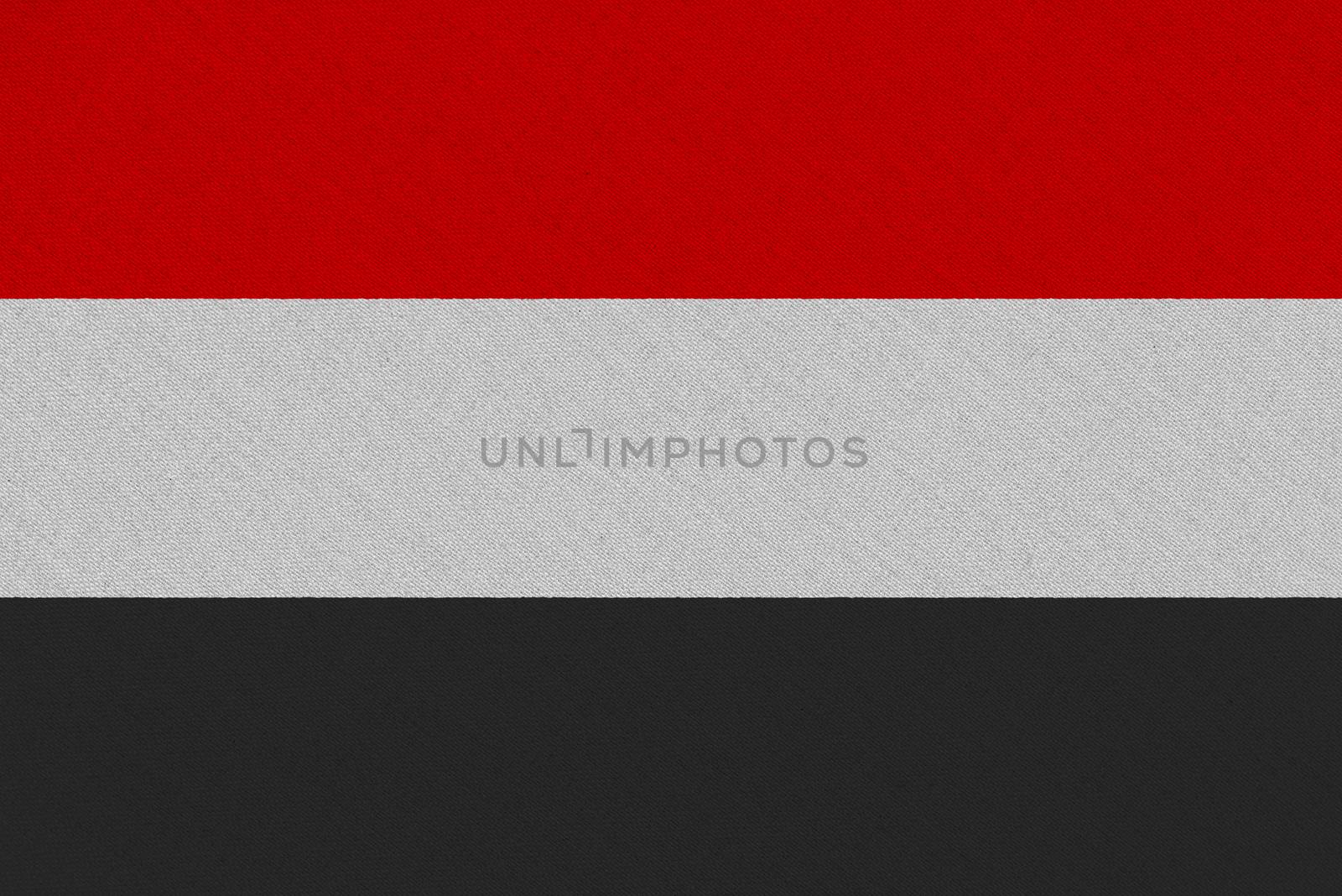 Yemen fabric flag. Patriotic background. National flag of Yemen