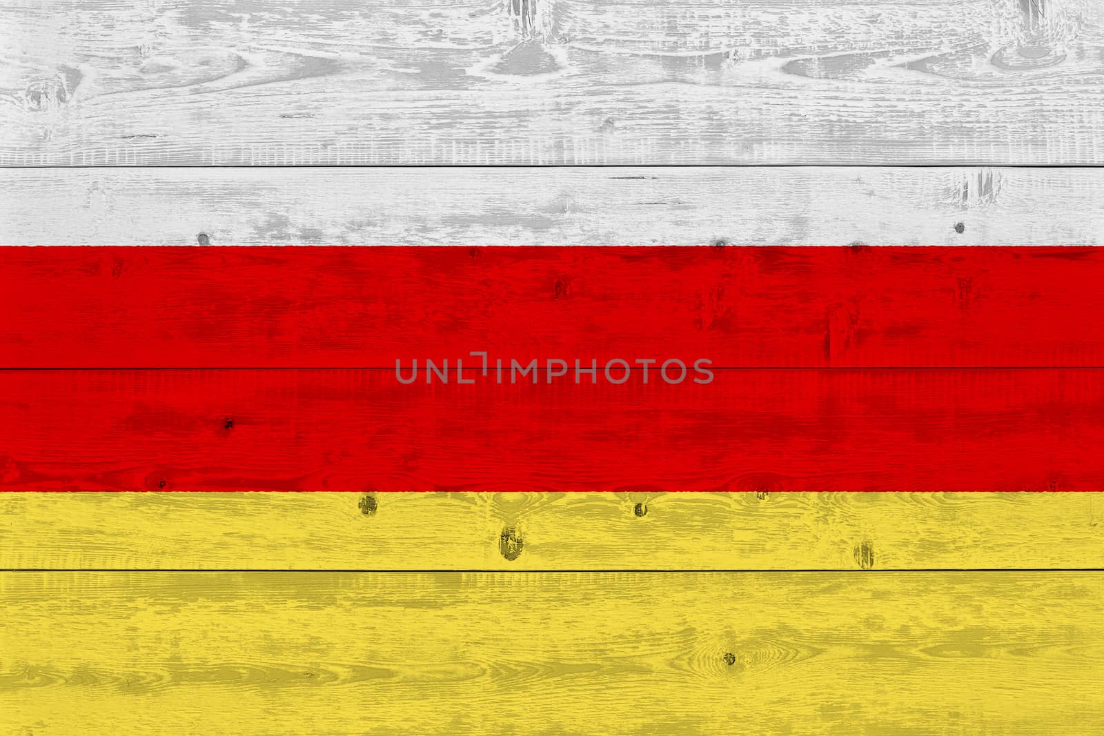 South ossetia flag painted on old wood plank. Patriotic background. National flag of South ossetia