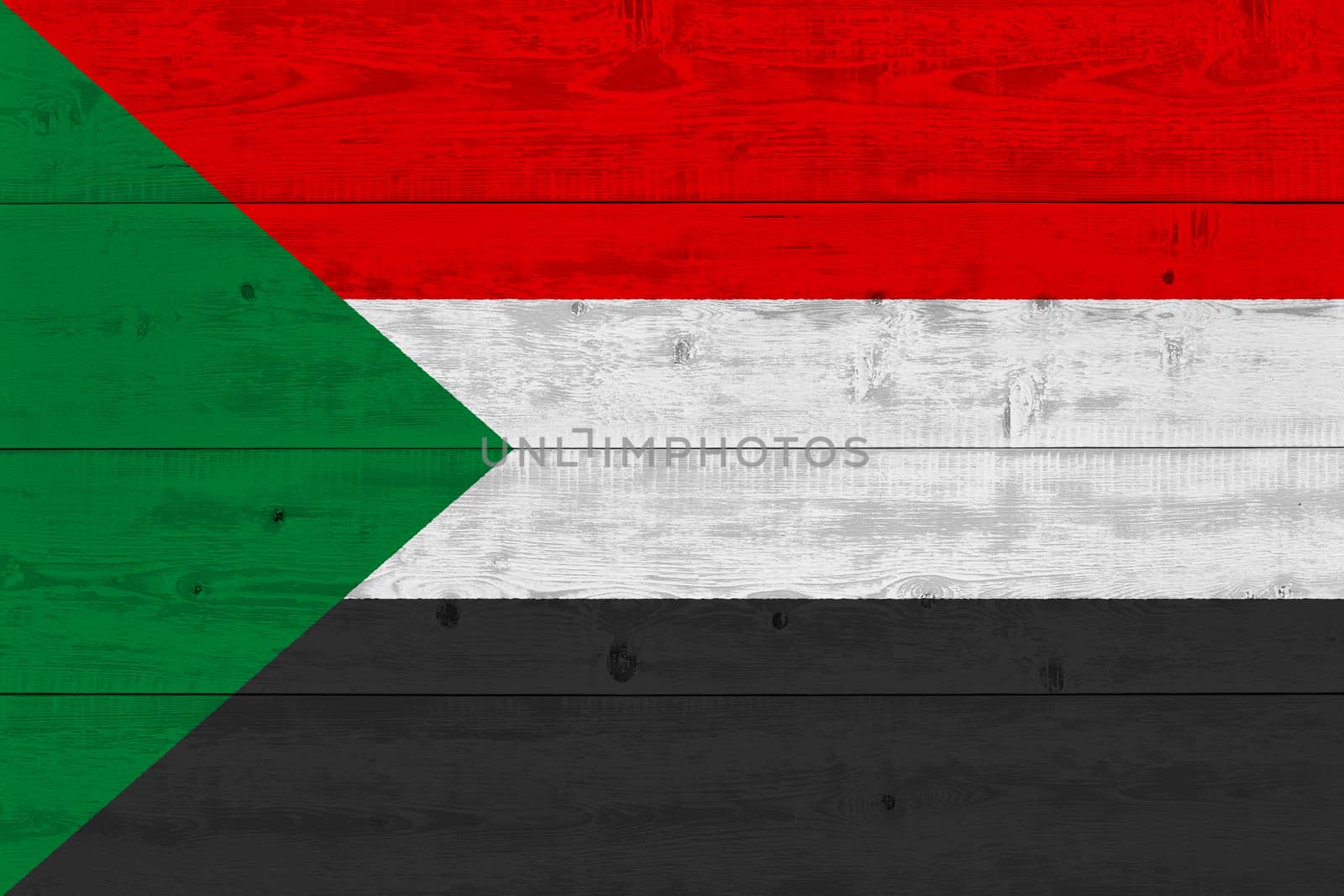 Sudan flag painted on old wood plank. Patriotic background. National flag of Sudan