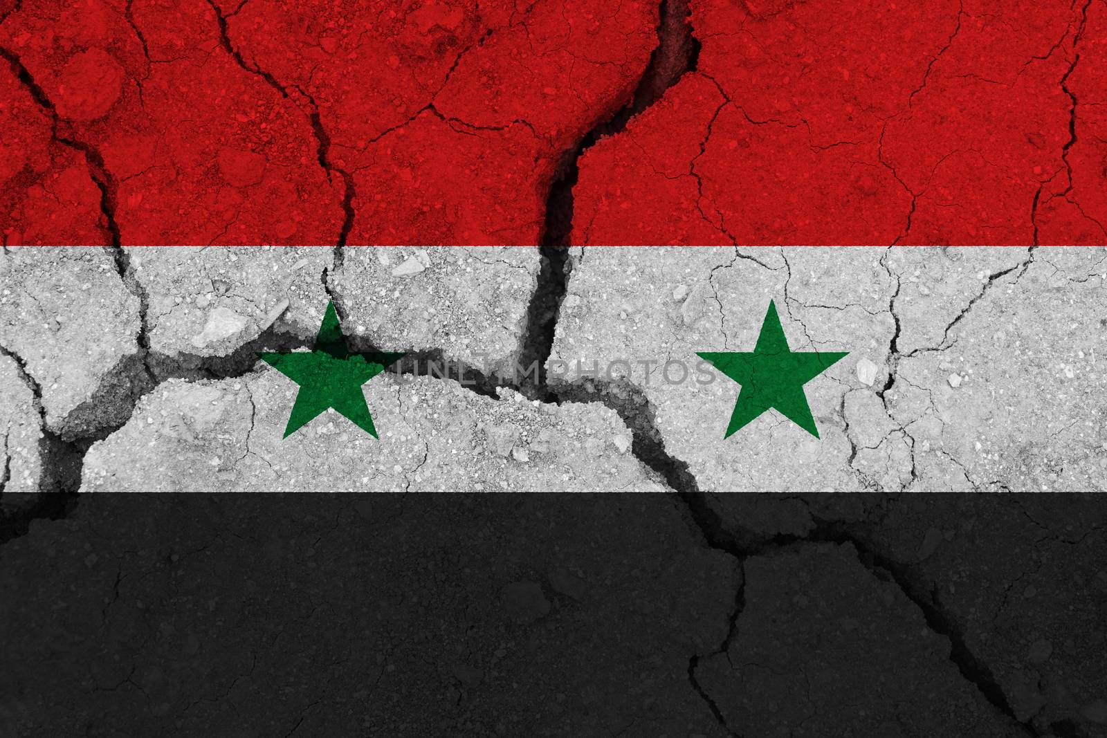 Syria flag on the cracked earth. National flag of Syria. Earthquake or drought concept