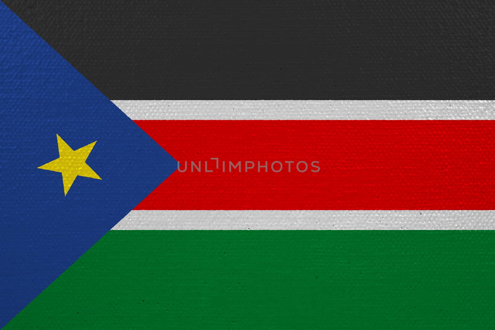 South Sudan flag on canvas. Patriotic background. National flag of South Sudan