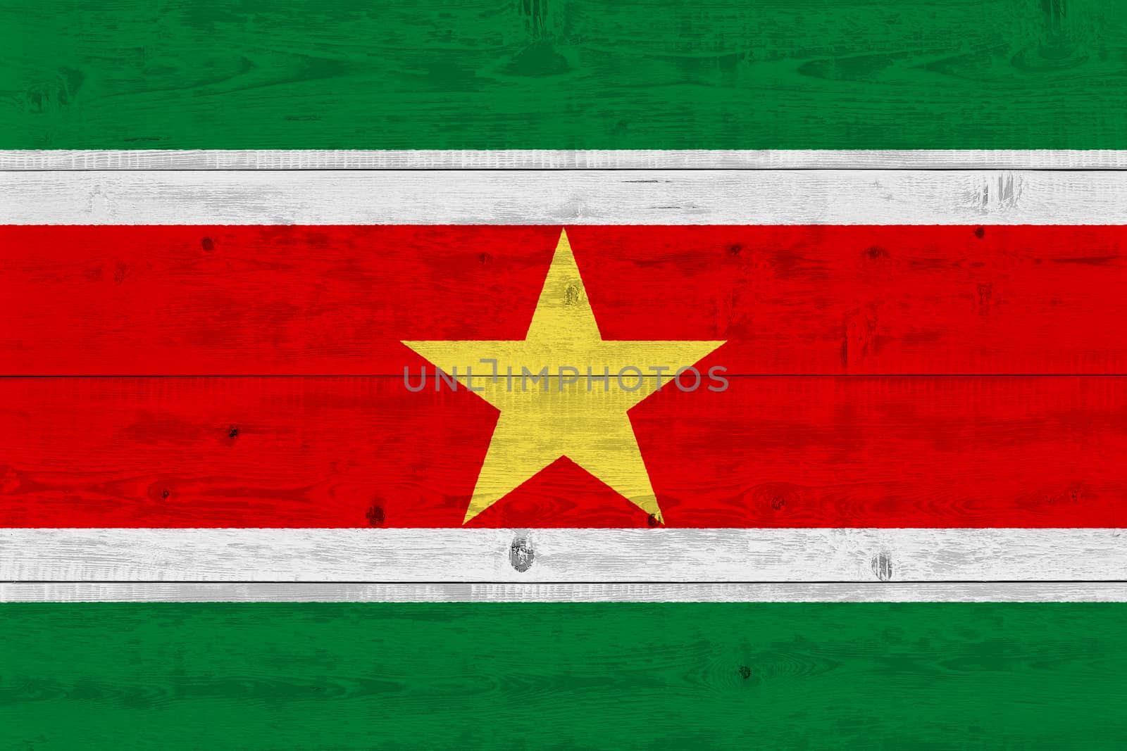 Suriname flag painted on old wood plank. Patriotic background. National flag of Suriname