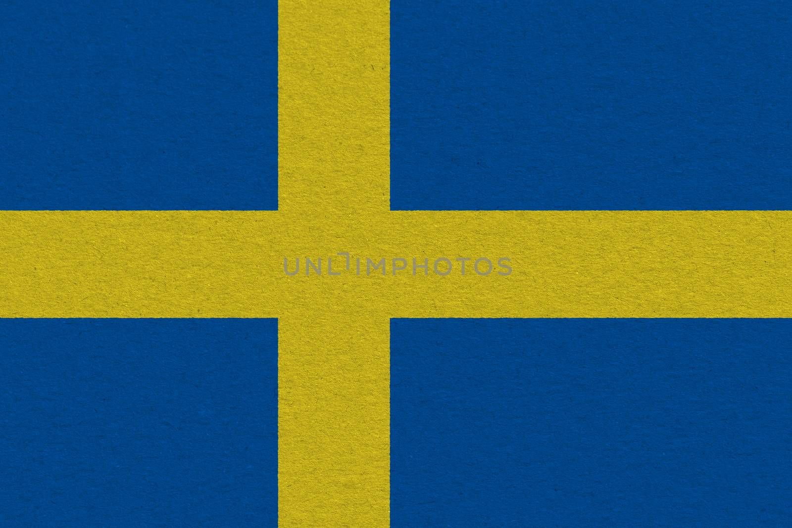 Sweden flag painted on paper. Patriotic background. National flag of Sweden