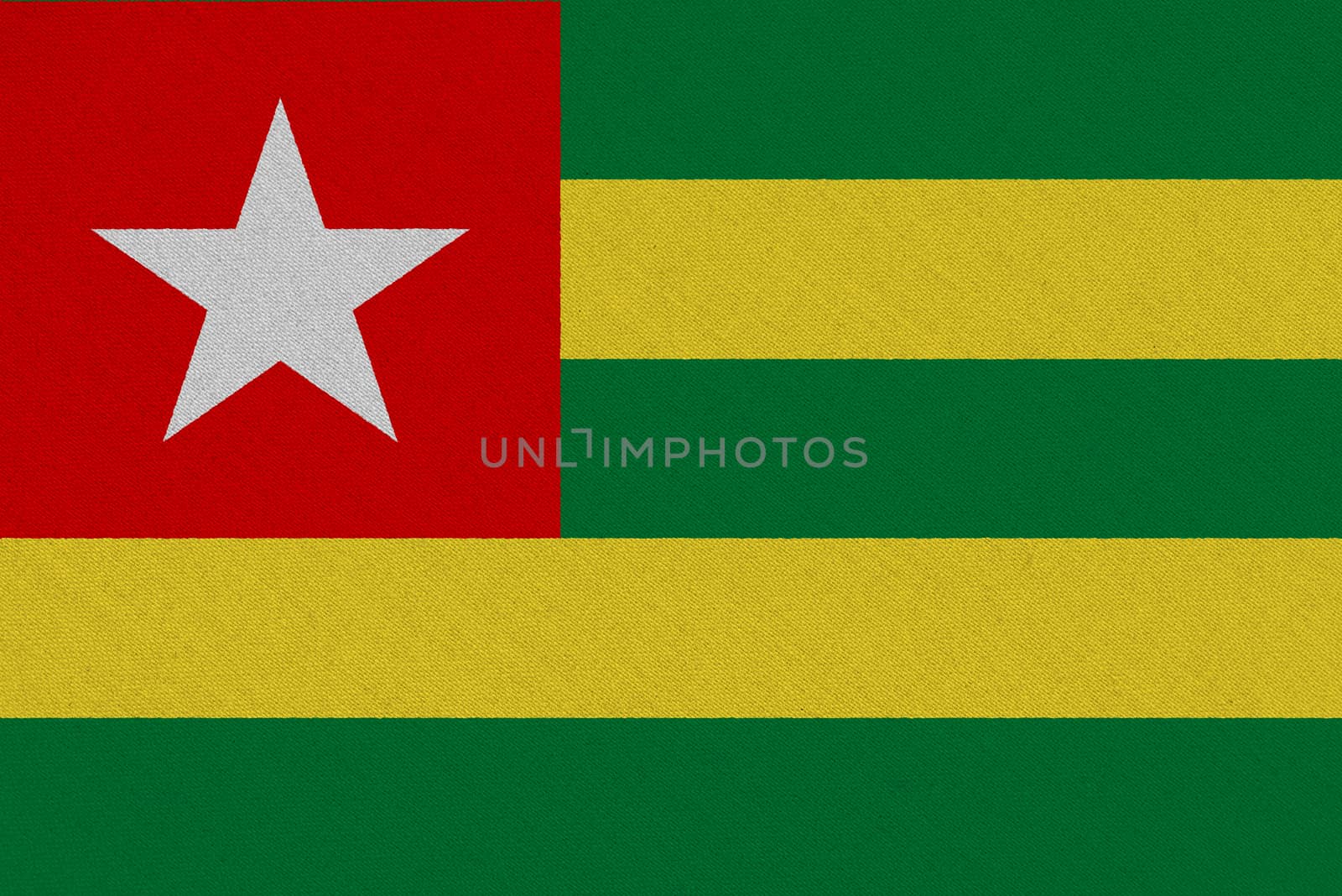 Togo fabric flag. Patriotic background. National flag of Togo