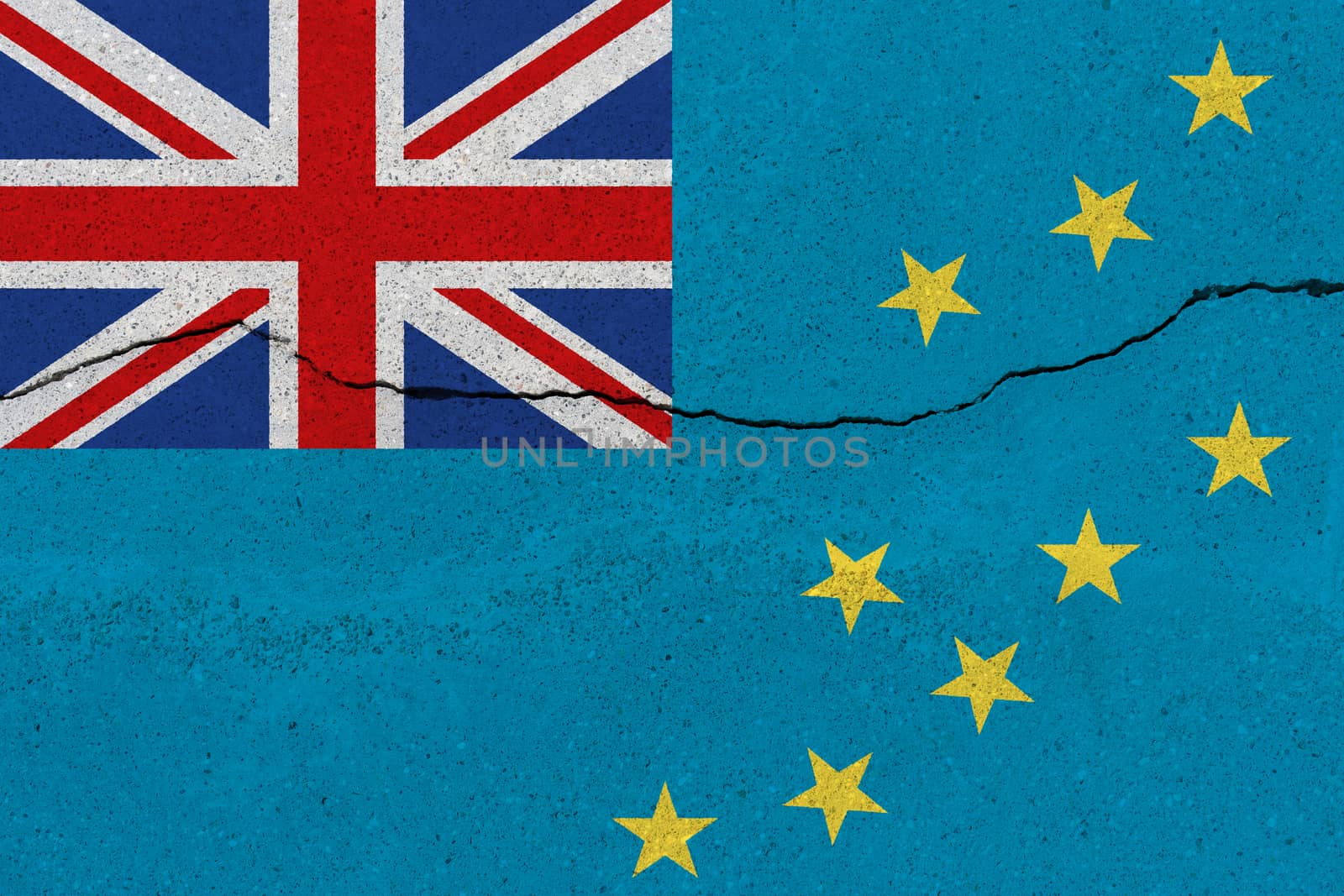 Tuvalu flag on concrete wall with crack. Patriotic grunge background. National flag of Tuvalu