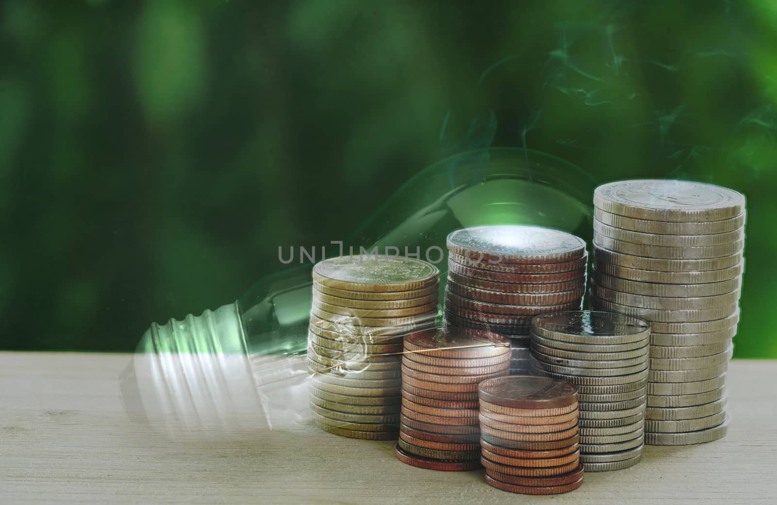 Abstract concept of stacked coins for income, expenses, electricity and utilities, finance and savings.