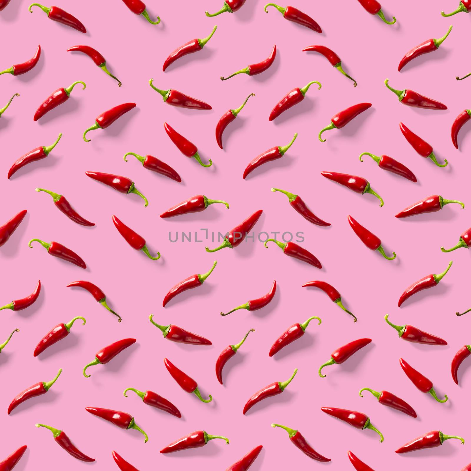 Red hot chilli seamless peppers pattern. Seamless pattern made of red chili or chilli on pink background. Minimal food pattern. Food background.