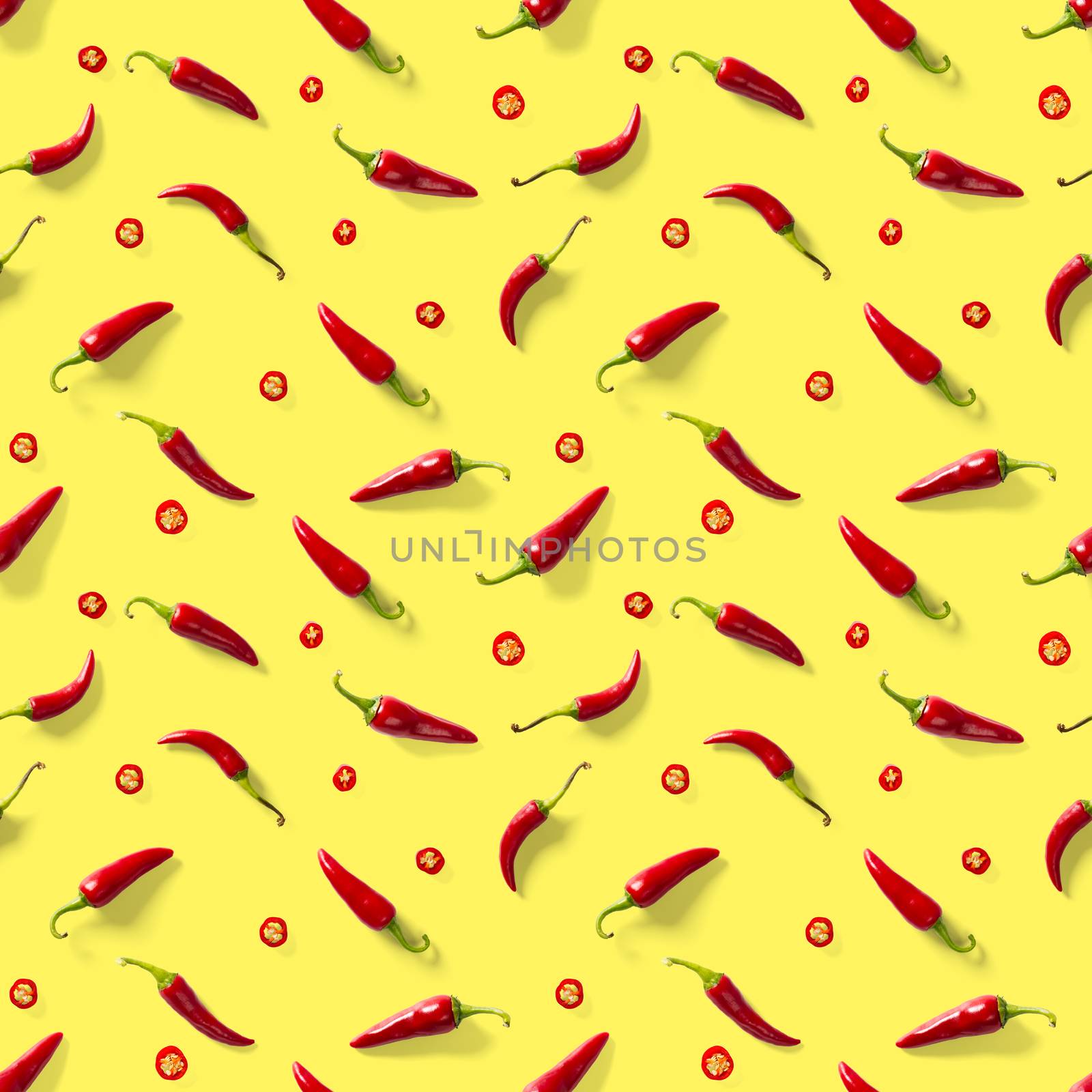 Red hot chilli seamless peppers pattern. Seamless pattern made of red chili or chilli on yellow background. Minimal food pattern. Food background.