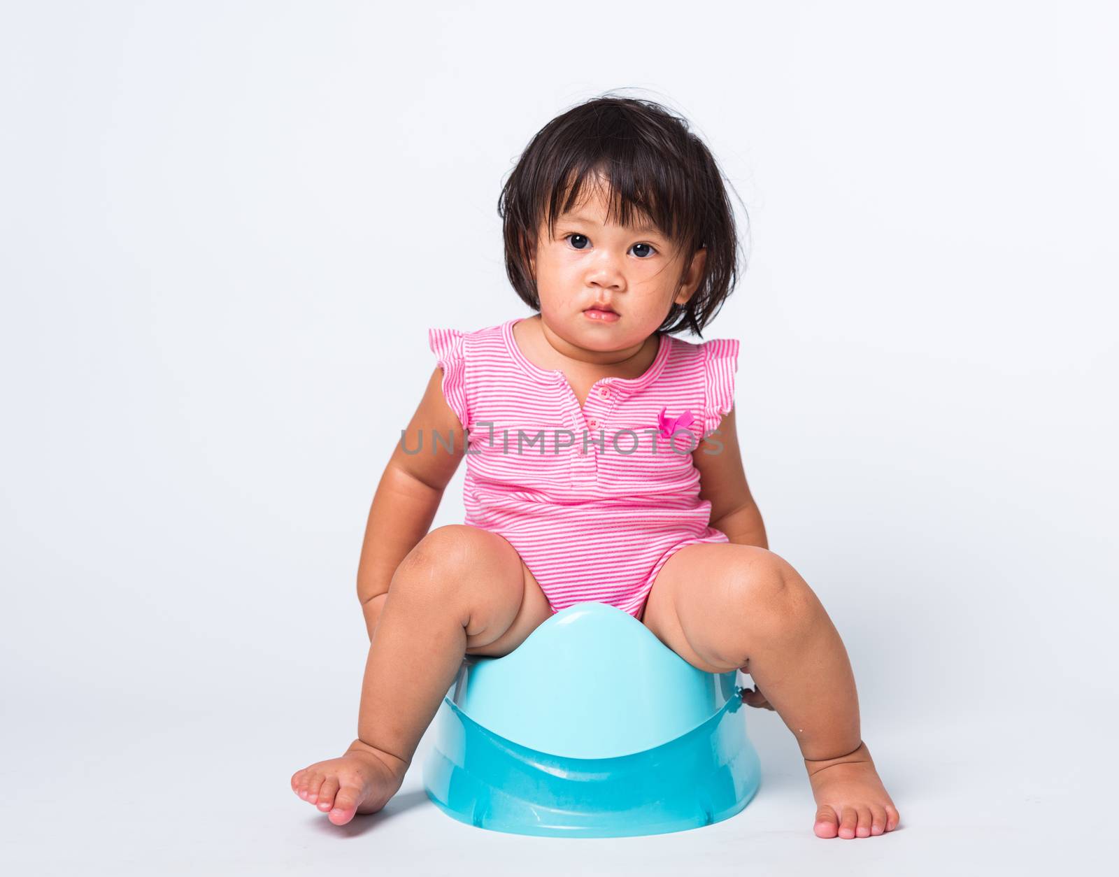 Asian little cute baby child girl education training to sitting on blue chamber pot or potty in, studio shot isolated on white background, wc toilet concept