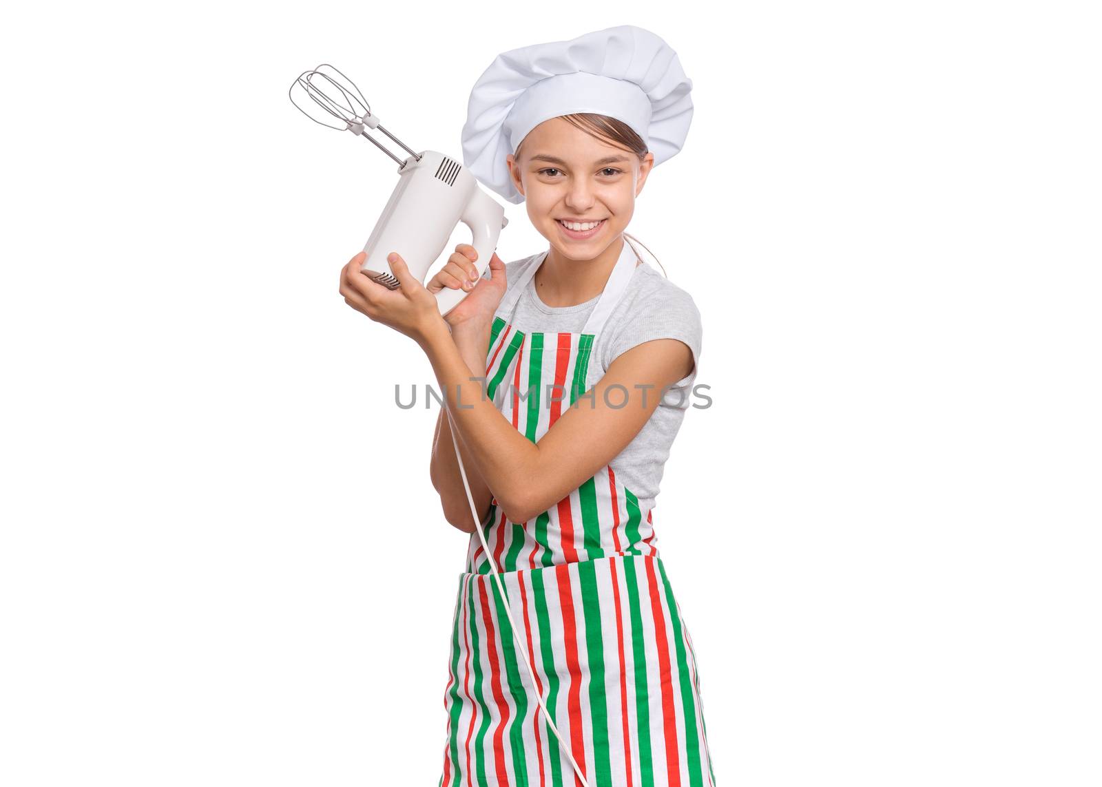 Teen girl in chef hat in apron with egg beater, isolated on white background.