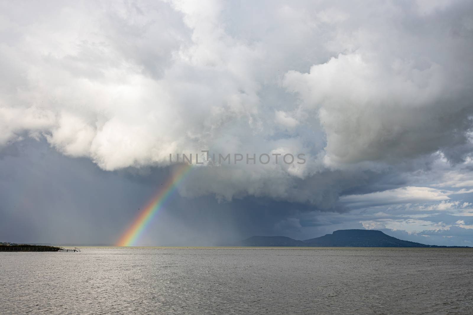 Rainbow over the Lake Balaton of Hungary in summertime by Digoarpi