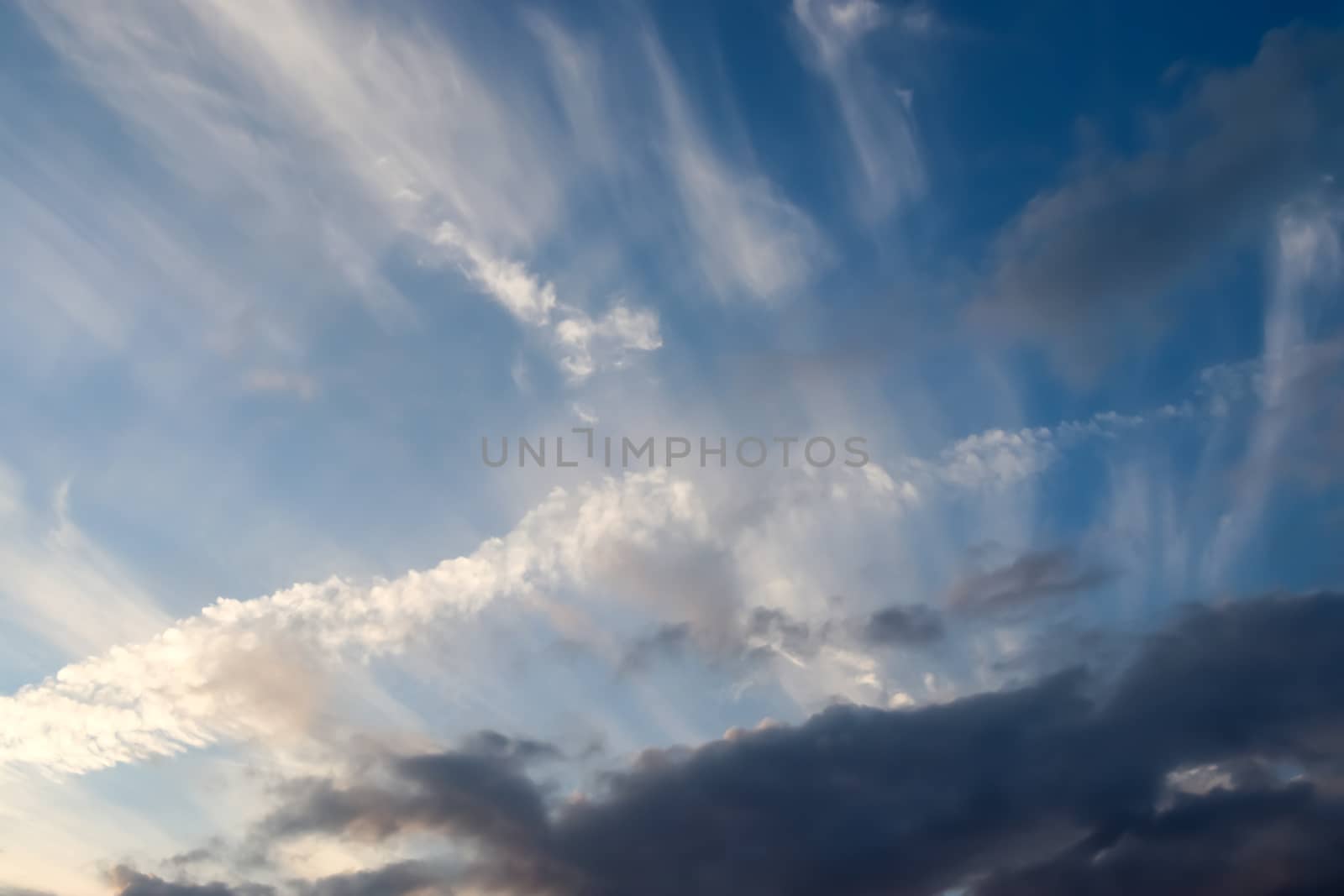 Beautiful panorama of orange and yellow clouds at sunrise and sunset in a blue sky