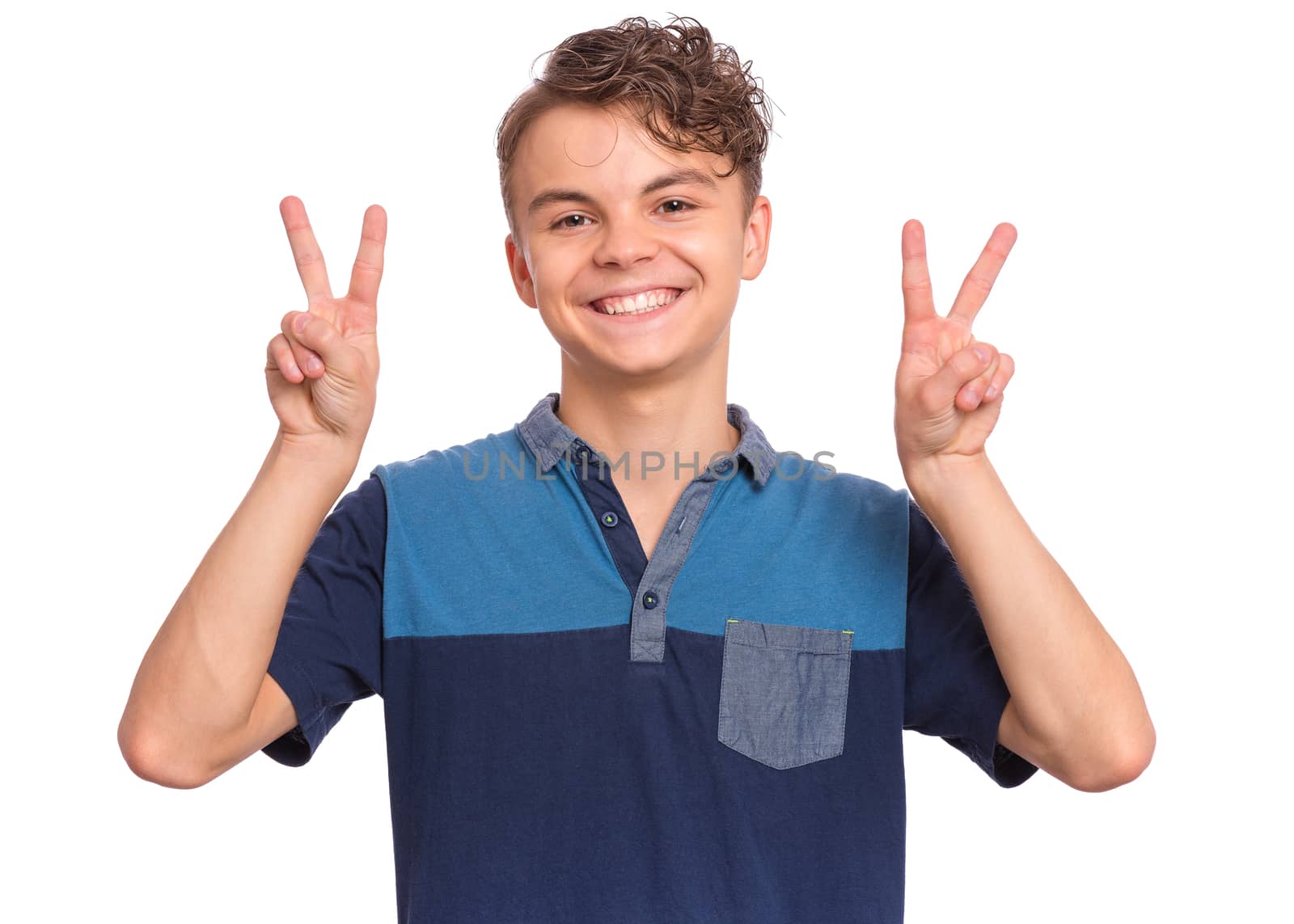 Happy boy showing victory sign isolated on white background