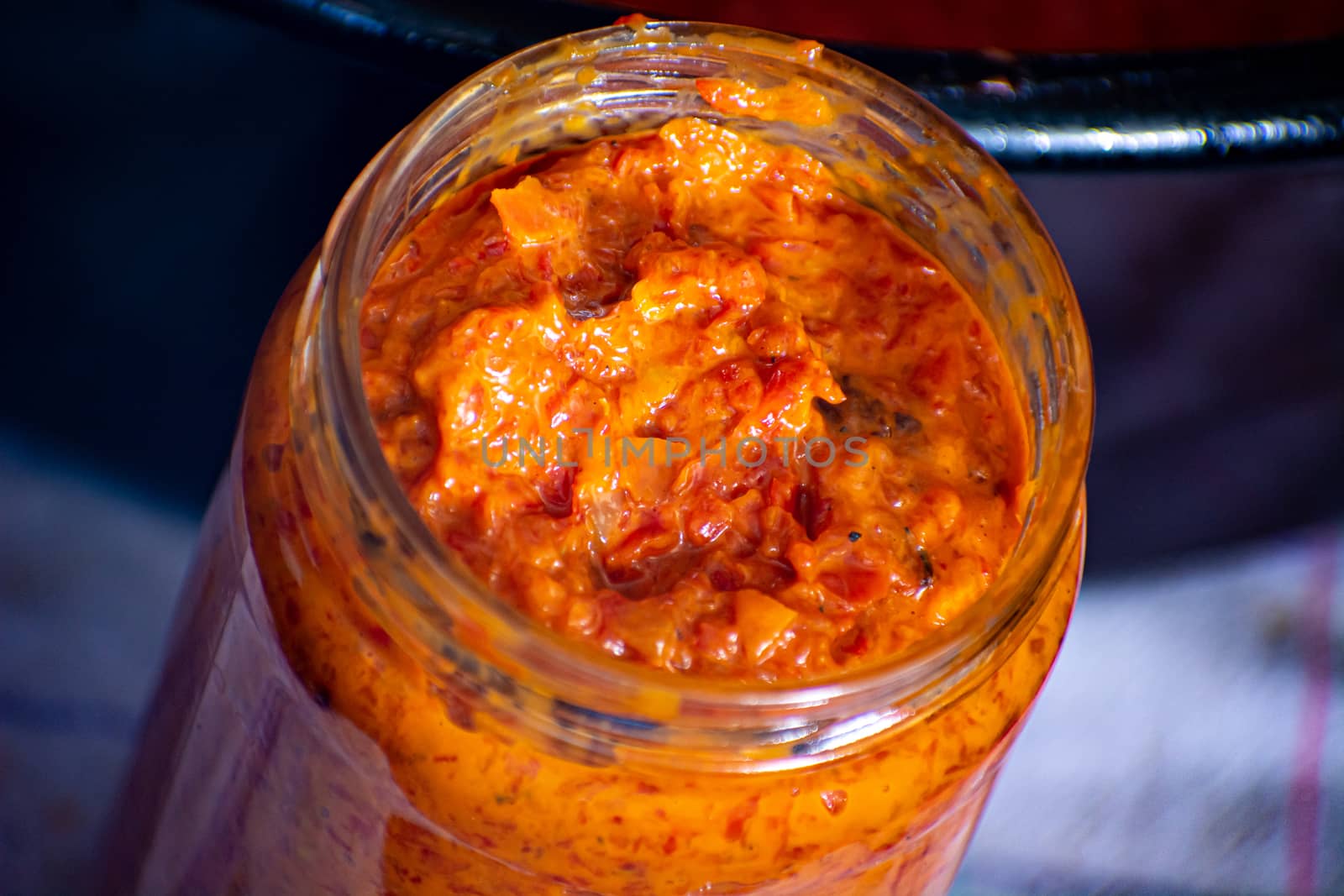 Freshly cooked ajvar in the glass jar. Shot from above