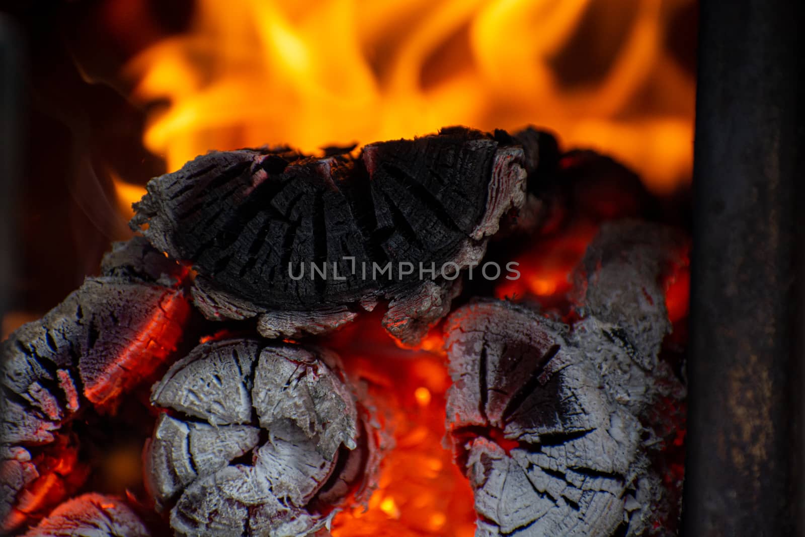 Close-up of fire in the old wooden stove. Wood logs in fire