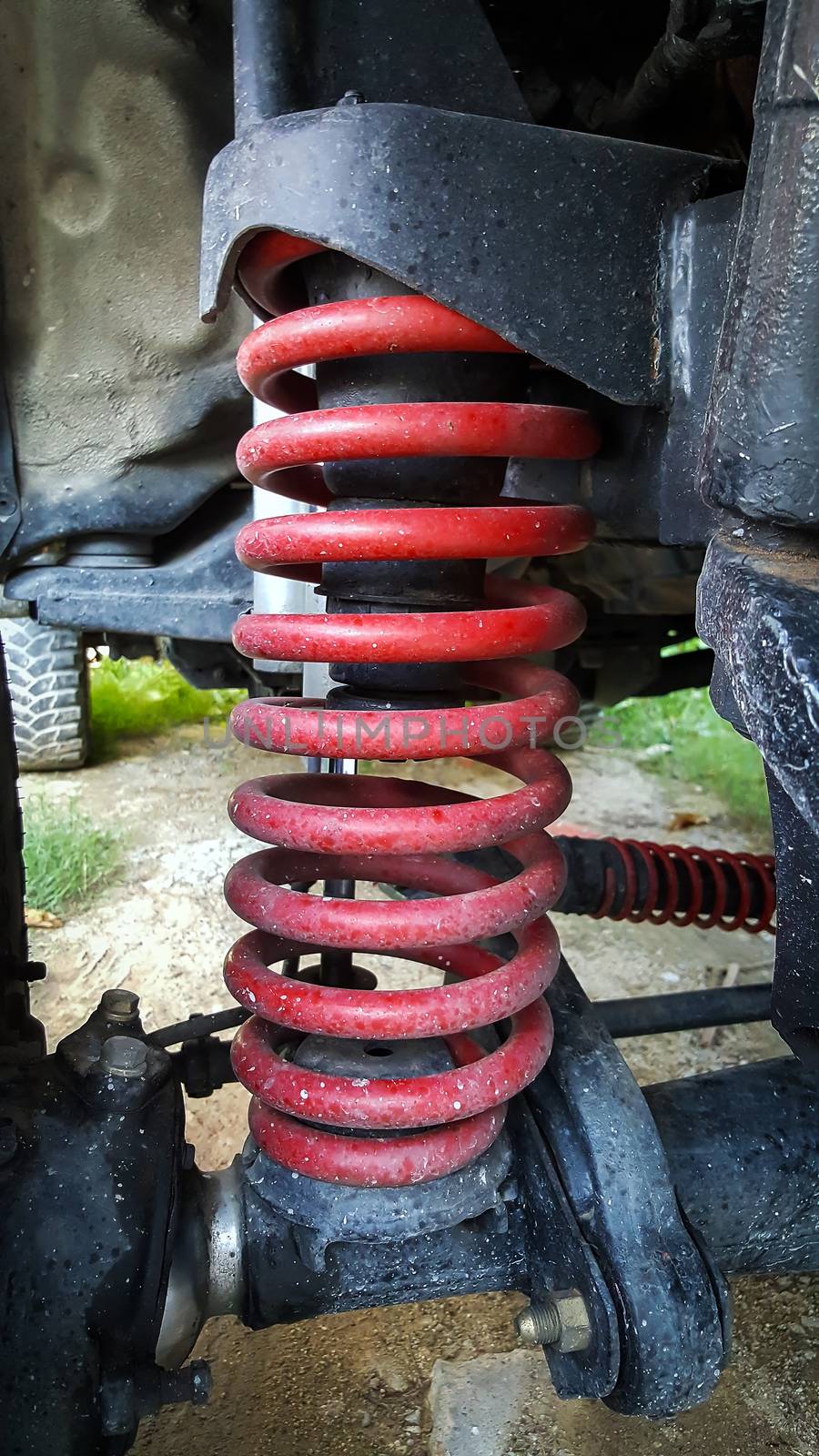 Closeup the shock absorbers and springs of a truck.