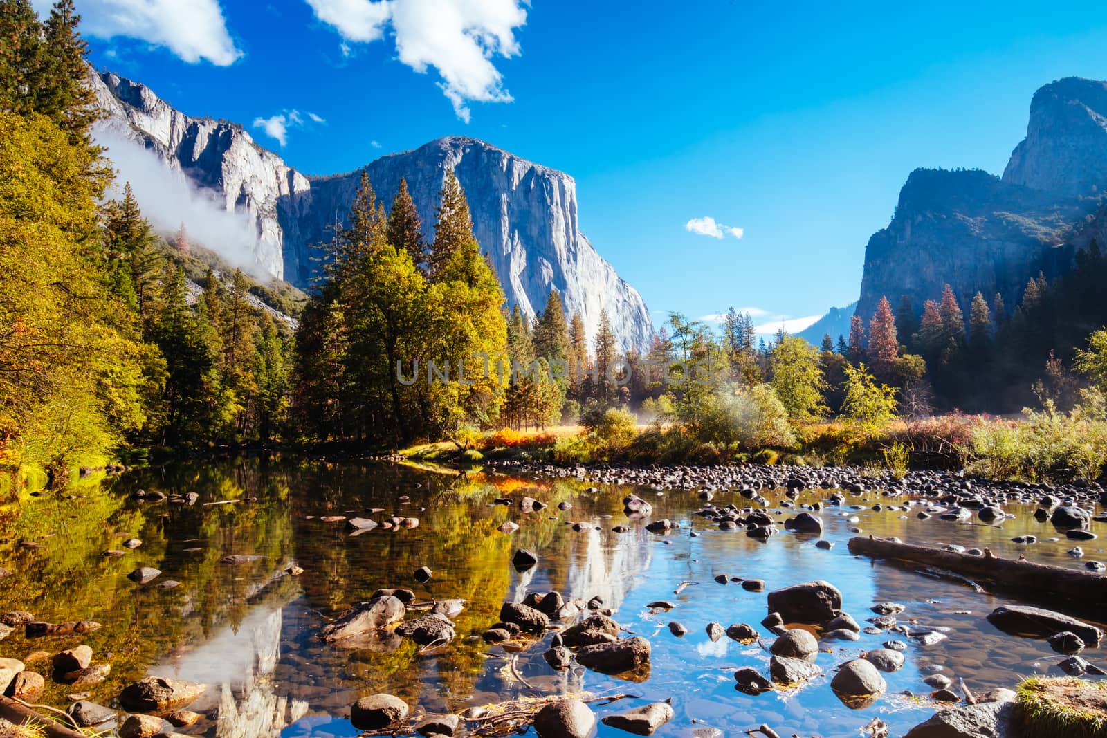 The view from within Yosemite Valley and Northside Drive of surrounding rock faces on a sunny autumn morning in California, USA