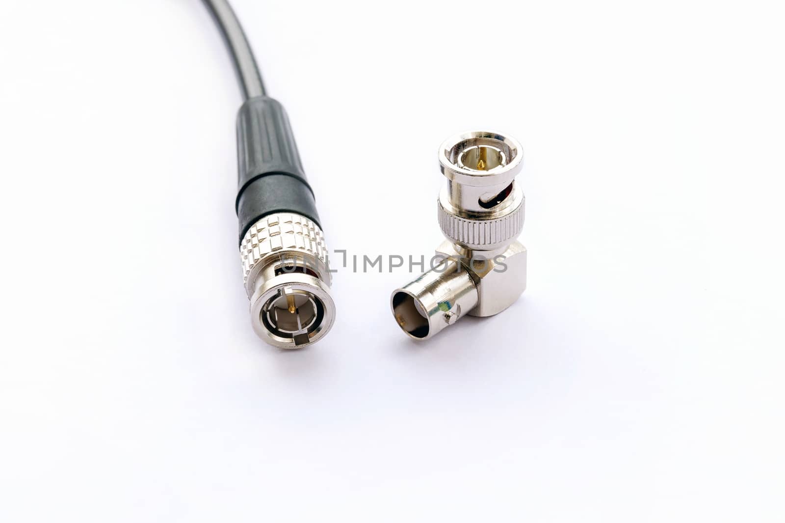 BNC connector jack with cable for video signal isolated on white background.