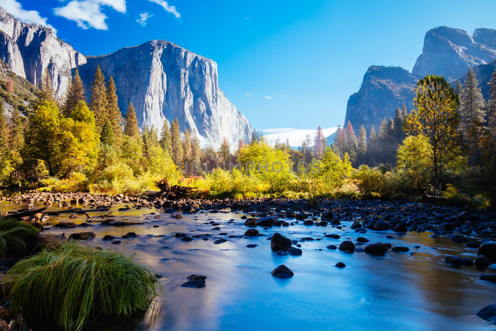 The view from within Yosemite Valley and Northside Drive of surrounding rock faces on a sunny autumn morning in California, USA