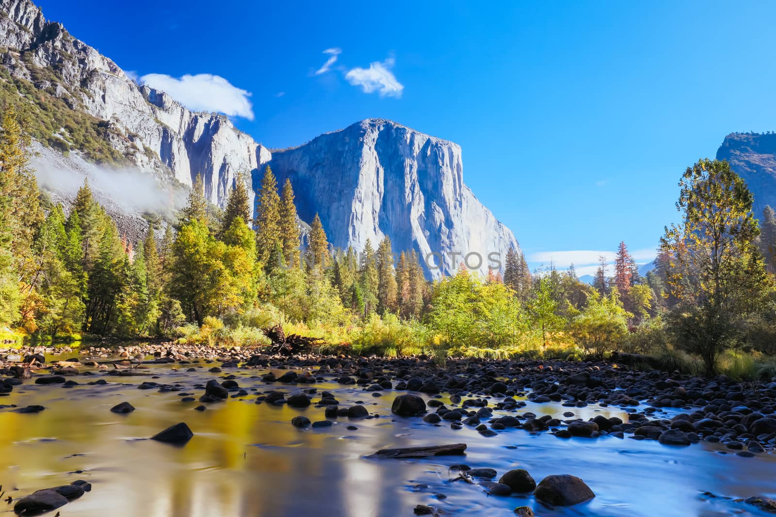 The view from within Yosemite Valley and Northside Drive of surrounding rock faces on a sunny autumn morning in California, USA