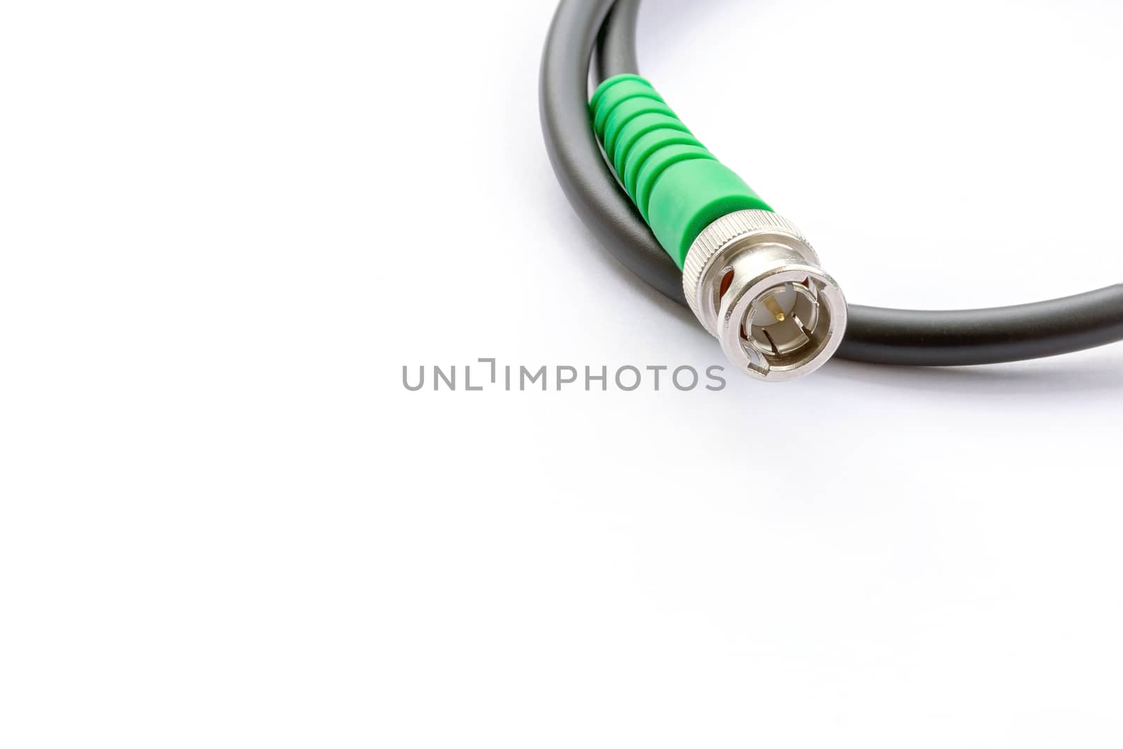 BNC connector jack with cable for video signal isolated on white background.