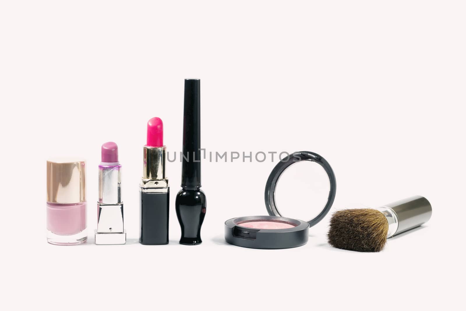 Closeup group of makeup cosmetics by wattanaphob