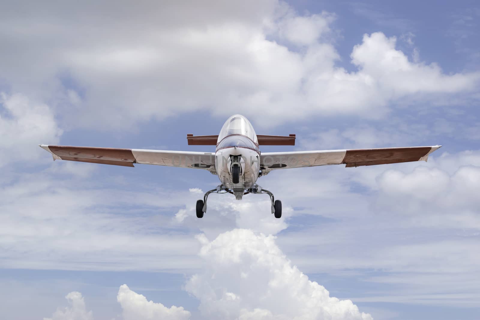 Closeup vintage aircraft flying on the sky.