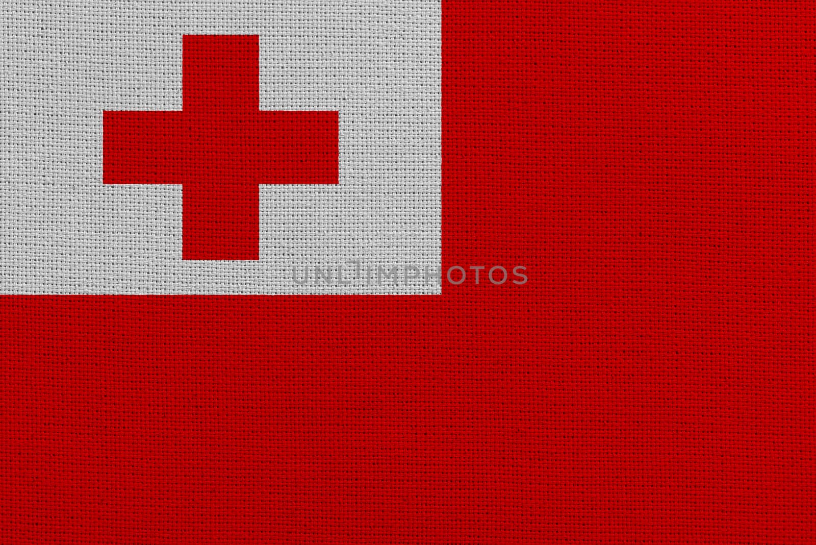 Tonga fabric flag. Patriotic background. National flag of Tonga