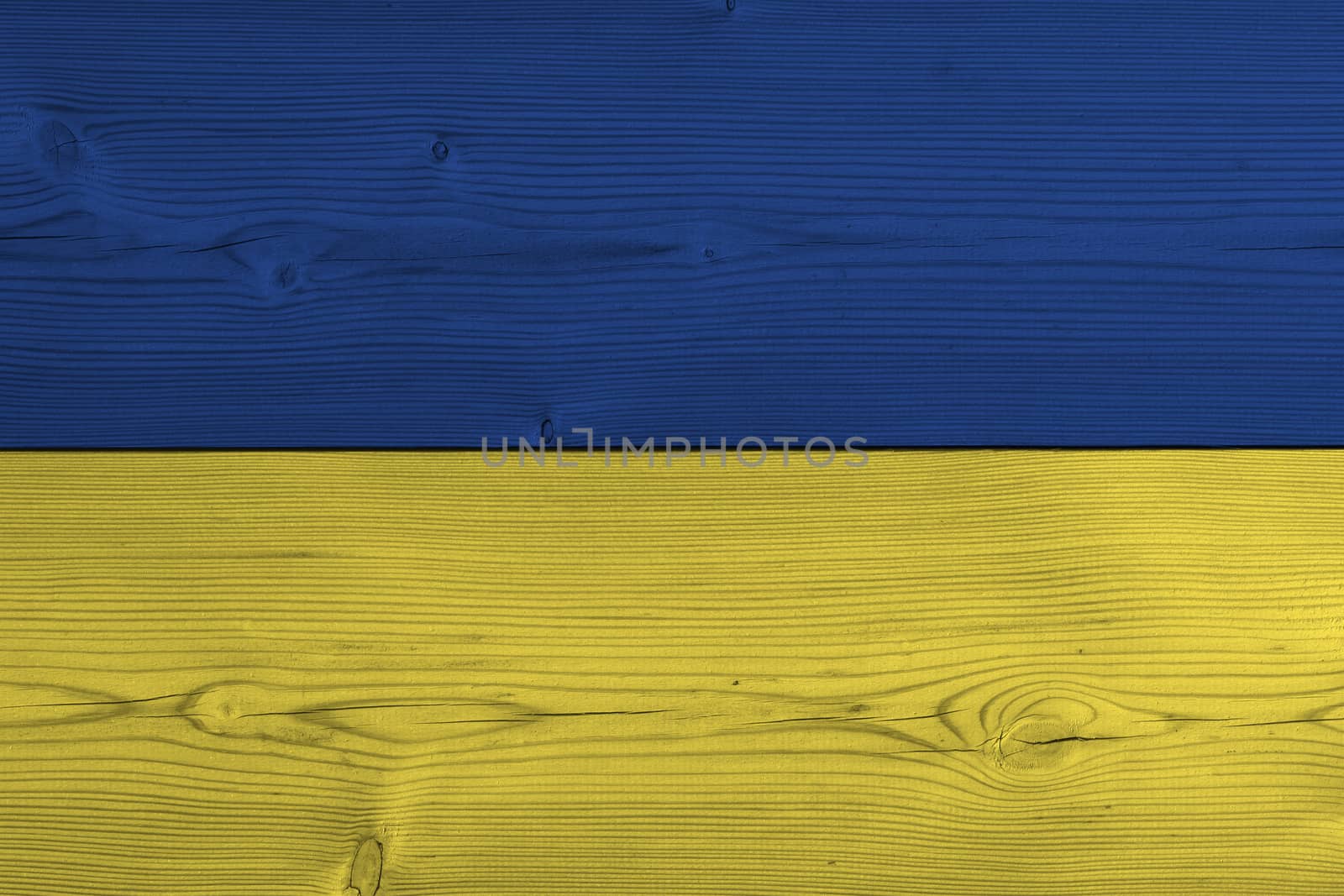 Ukraine flag painted on old wood plank. Patriotic background. National flag of Ukraine