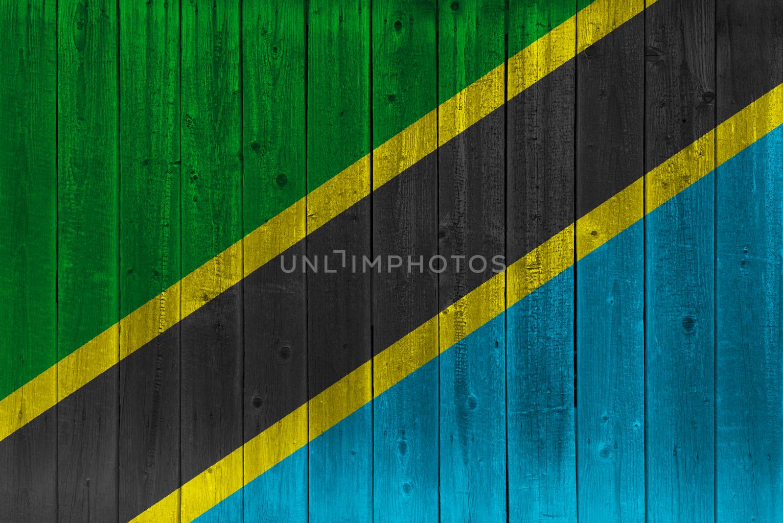 Tanzania flag painted on old wood plank. Patriotic background. National flag of Tanzania