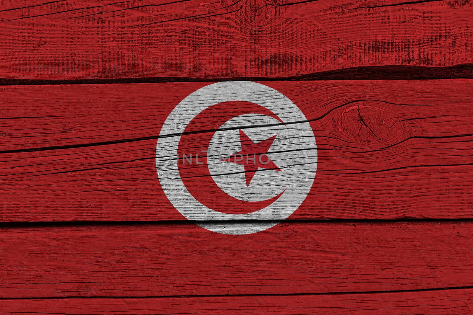 Tunisia flag painted on old wood plank. Patriotic background. National flag of Tunisia