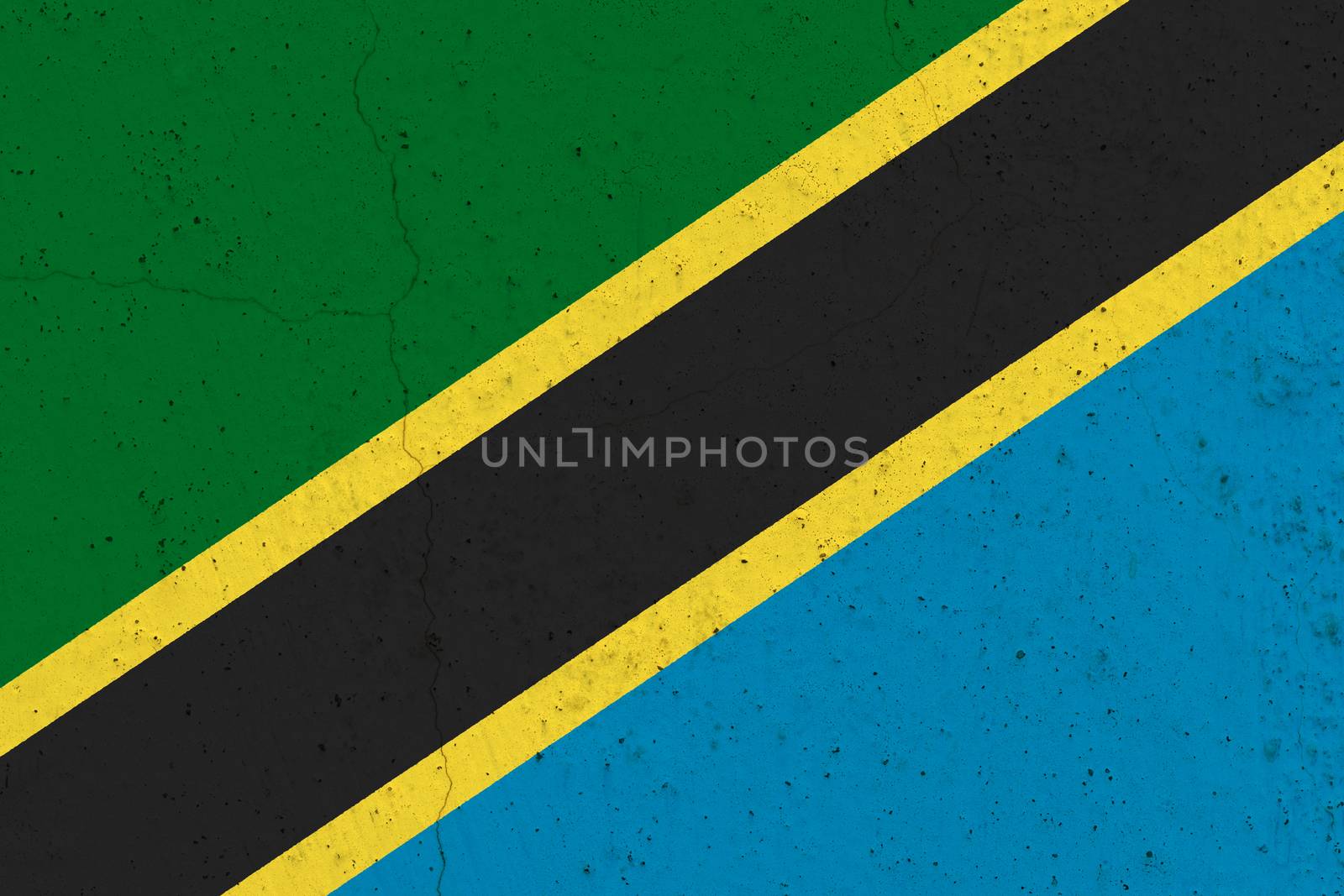 Tanzania flag on concrete wall. Patriotic grunge background. National flag of Tanzania