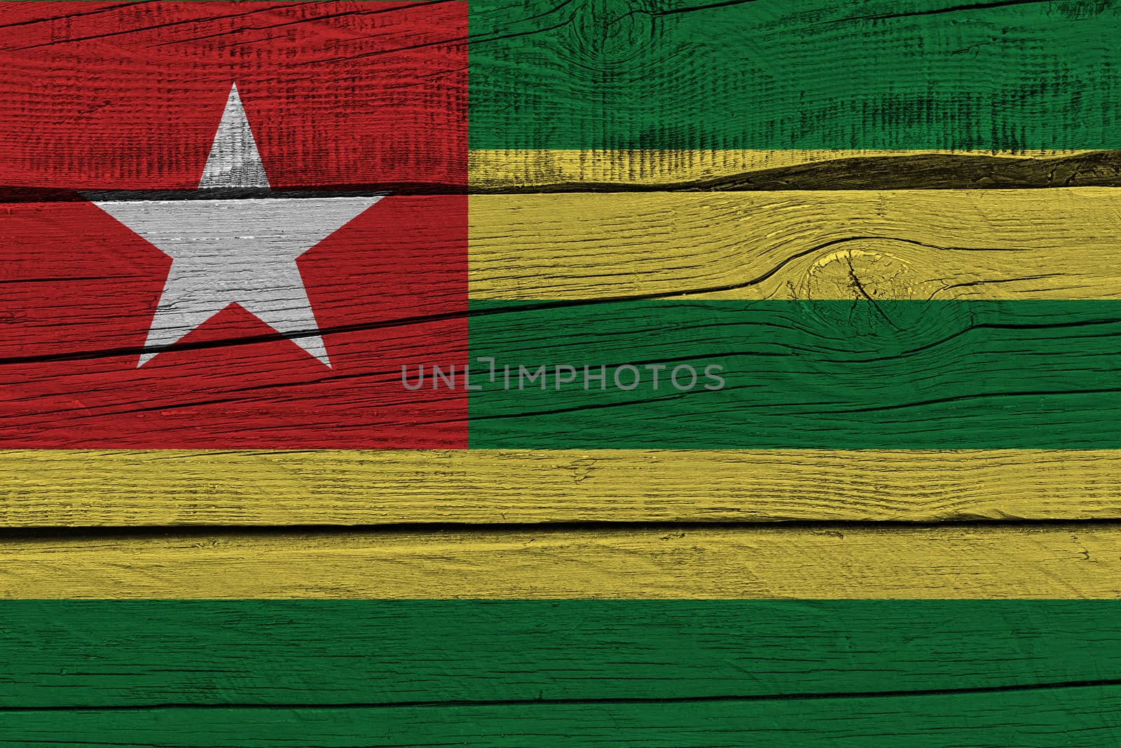 Togo flag painted on old wood plank. Patriotic background. National flag of Togo