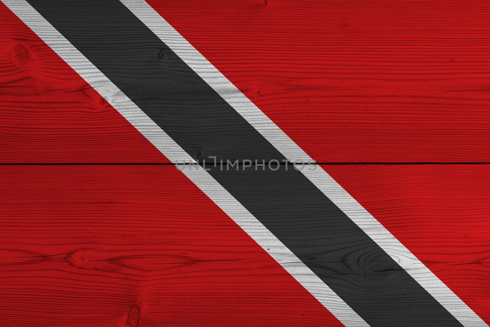 Trinidad and Tobago flag painted on old wood plank. Patriotic background. National flag of Trinidad and Tobago