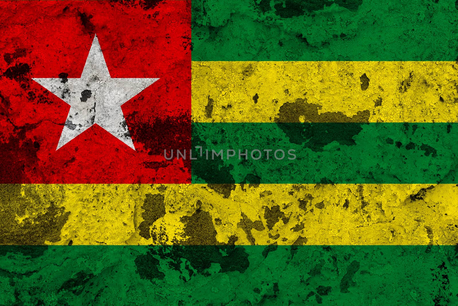 Togo flag on old wall. Patriotic grunge background. National flag of Togo