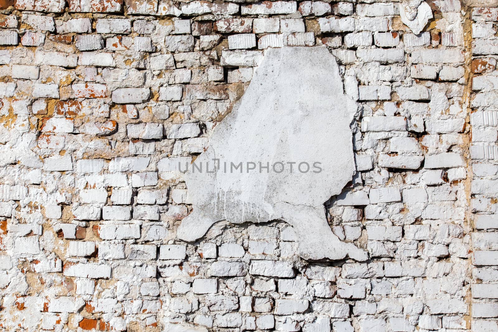 old brick wall with white plaster - full frame background and texture.
