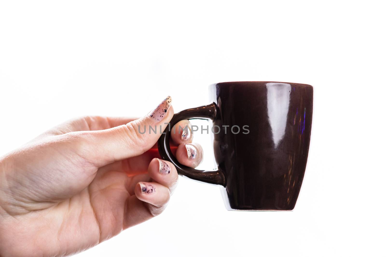 Woman hand holding a cup isolated on white background. by vladispas